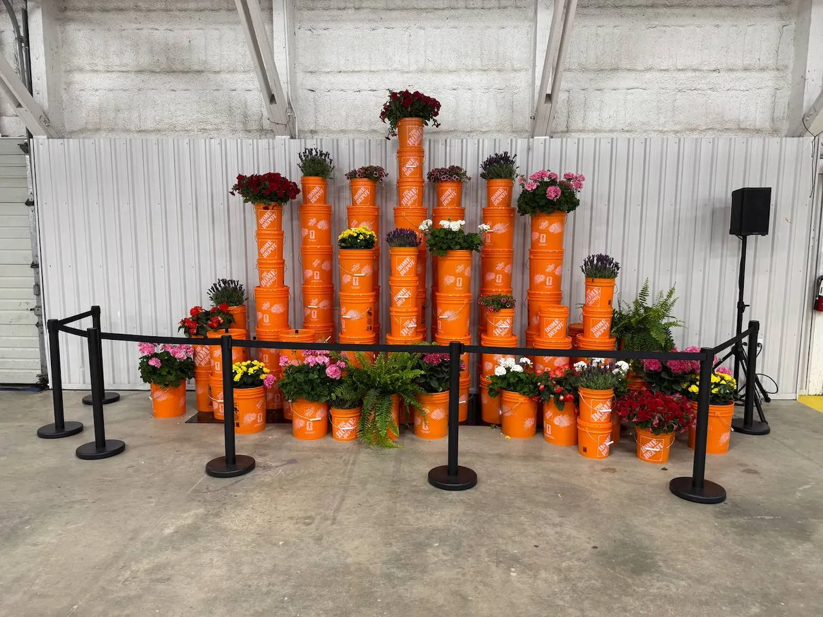 Black belt stanchions fencing off a product display